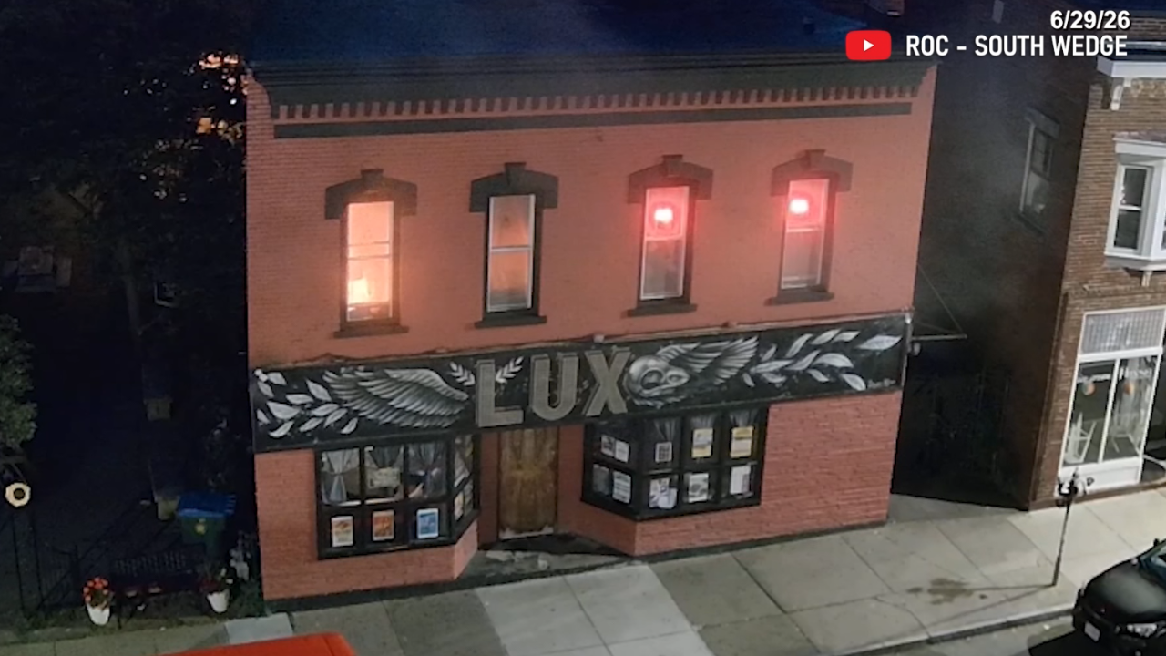 Lux Lounge bar exterior with construction workers during renovations
